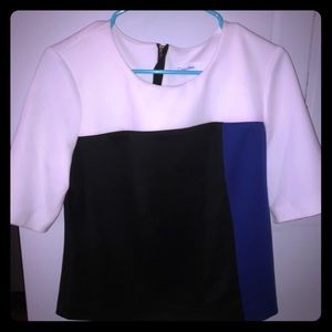 A white,black and dark blue shirt by Calvin Klein.